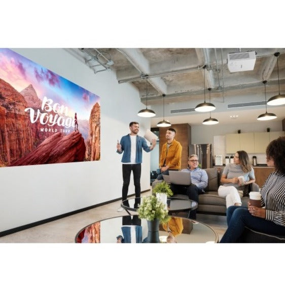 Conference room setting showing Panasonic projector in use during a presentation