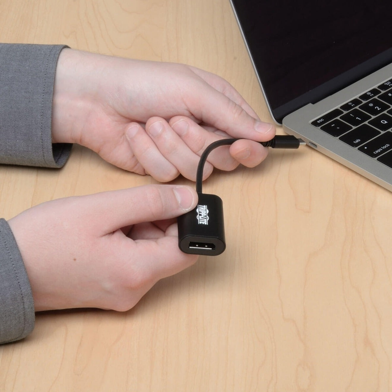 Close-up of USB-C connector being inserted into laptop port-alternate-image4