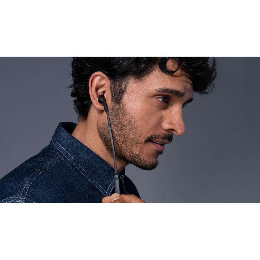 Person wearing Belkin ROCKSTAR earbuds showing comfortable fit-alternate-image7