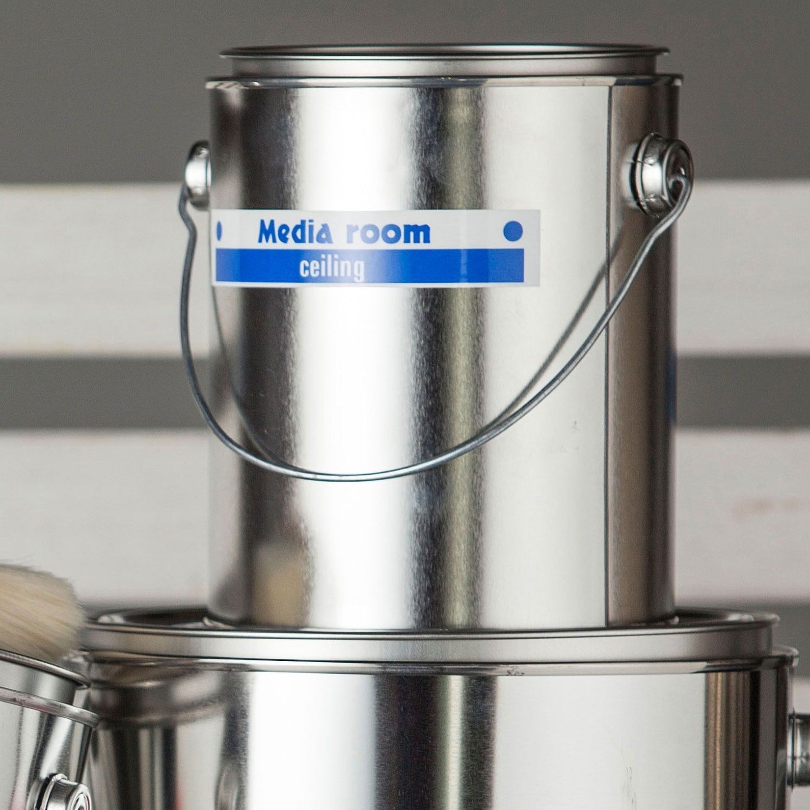 Brother P-touch label applied to a metal paint container showing durability in workshop environment-alternate-image8