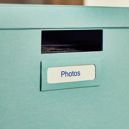 Close-up of blue-on-white Brother P-touch label applied to a photo storage box-alternate-image7
